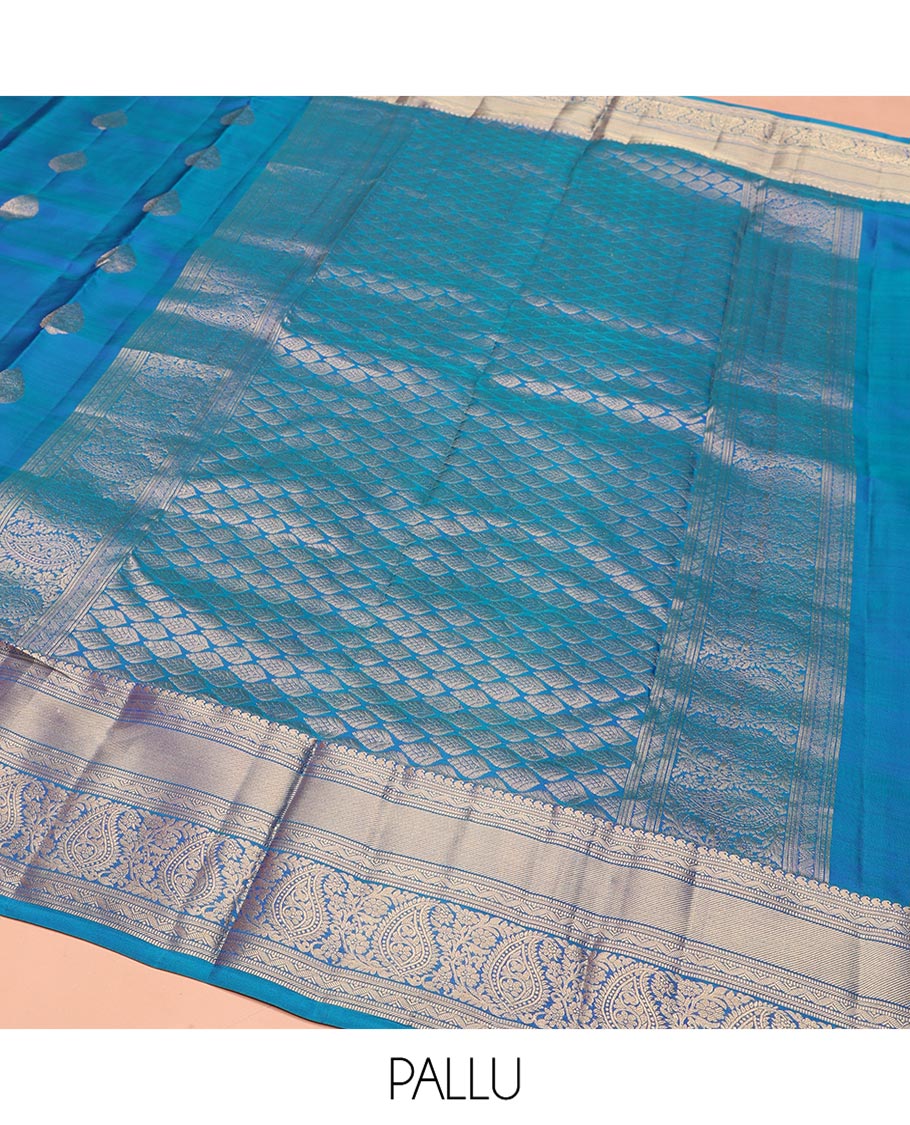 Blue Vasundhara Silk Saree, Mesmerized with Zari Buttas on Its Body, Highlighted by a Zari Border of Manga Mokku, Muthu, and Arumbu Manga Designs, Pallu Steeped with Leaf Designs, and Paired with a Matching Blouse - Image 5