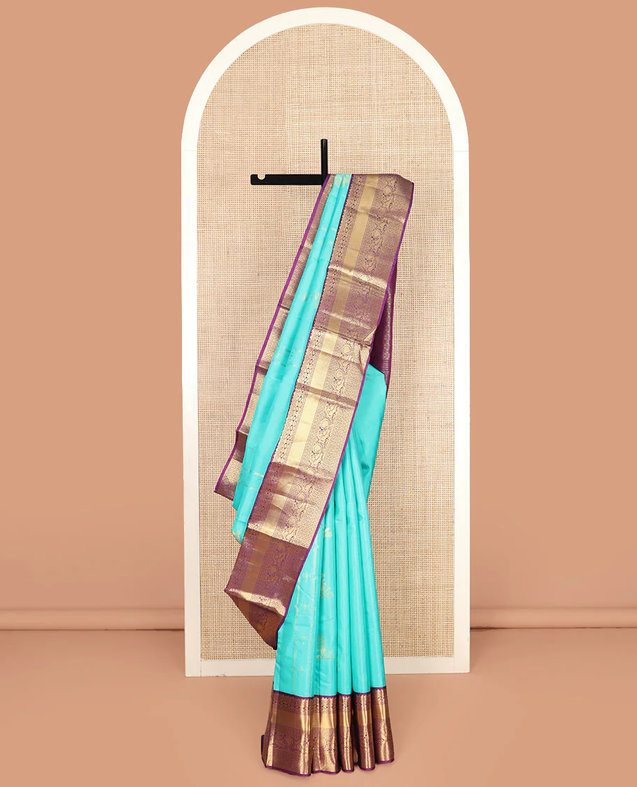 Blue Vasundhara Silk Saree Prettified with Zari Buttas, Complemented by a Contrast Blouse of Banaras, Paisa, Diamond, and Mayil Designs, Grandly Woven Pallu of Jaal Designs, and a Contrast Zari Bordered Blouse