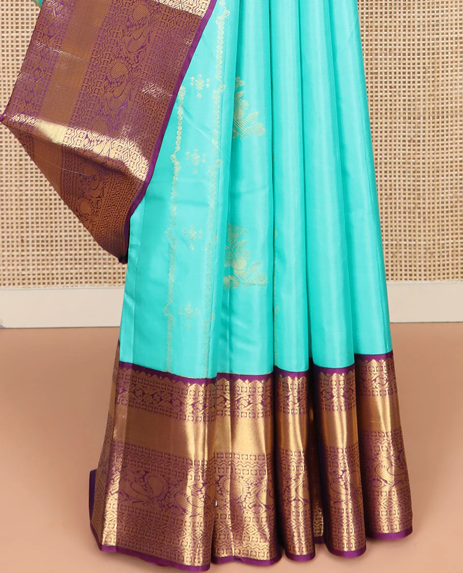 Blue Vasundhara Silk Saree Prettified with Zari Buttas, Complemented by a Contrast Blouse of Banaras, Paisa, Diamond, and Mayil Designs, Grandly Woven Pallu of Jaal Designs, and a Contrast Zari Bordered Blouse - Image 4