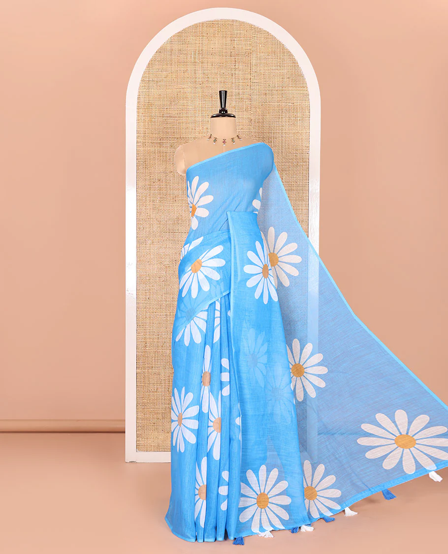Borderless Blue Linen Saree Beautified with Big Daisy Flower Motifs Printed All Over the Body and Pallu, Complemented by a Contrast Blouse Printed with Daisy Flower Motifs