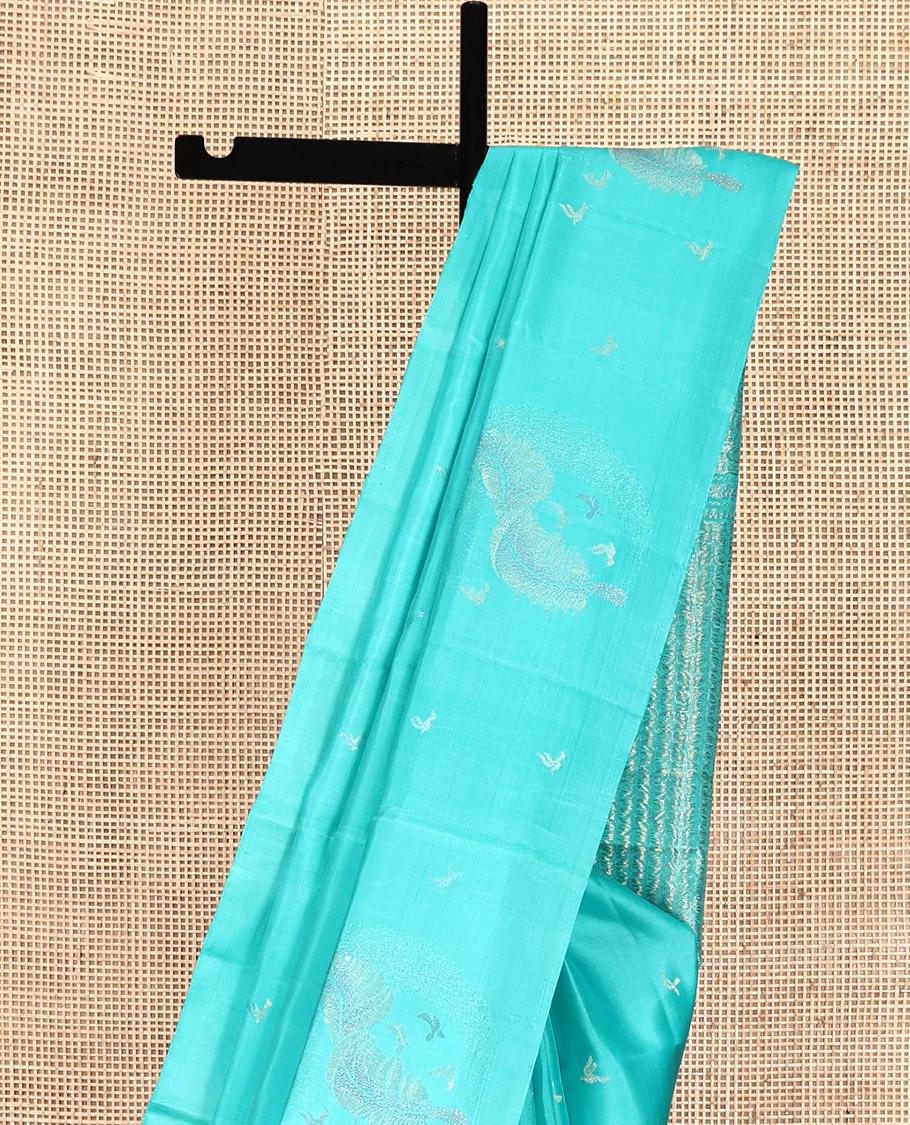 Borderless Blue Mayuri Soft Silk Saree, Subtly Woven with Buttas All Over Its Body, Highlighted by Pallu of Sparsely Woven Designs, and Paired with a Matching Blouse - Image 3