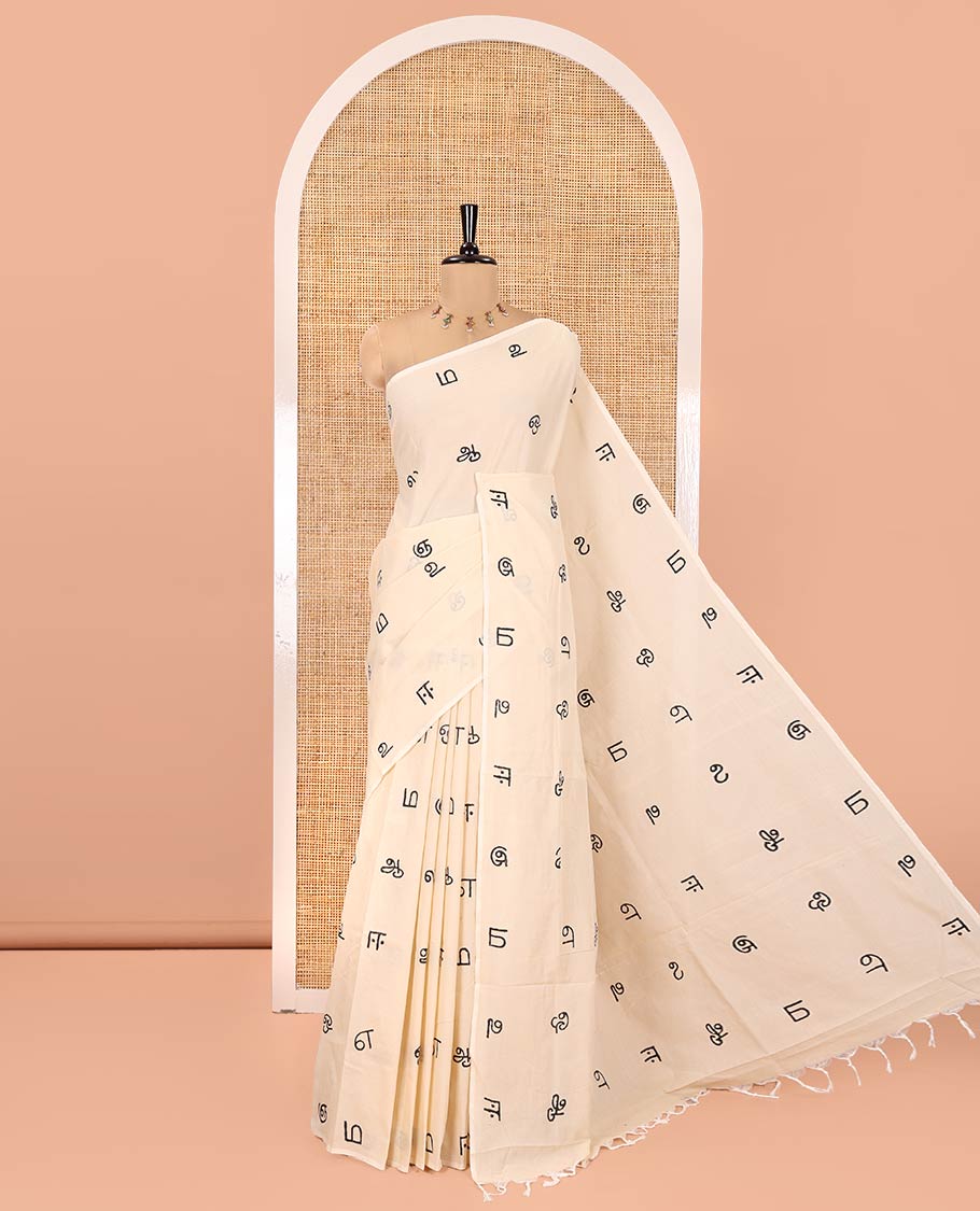Borderless Cream South Cotton Saree, Elevated with Tamil Letters Printed on Its Body, a Self-Pallu, and Comes with a Matching Blouse, and a Contrast Printed Blouse - Image 5