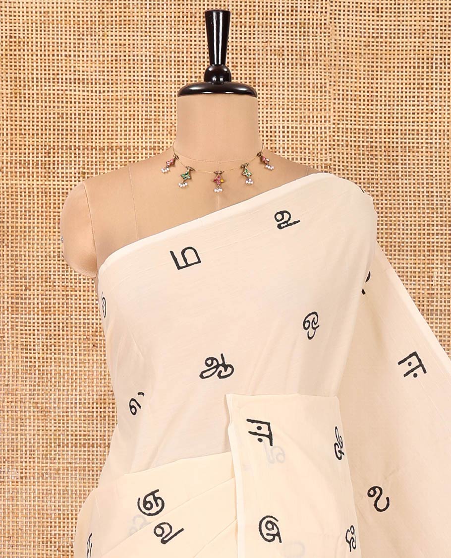 Borderless Cream South Cotton Saree, Elevated with Tamil Letters Printed on Its Body, a Self-Pallu, and Comes with a Matching Blouse, and a Contrast Printed Blouse - Image 6