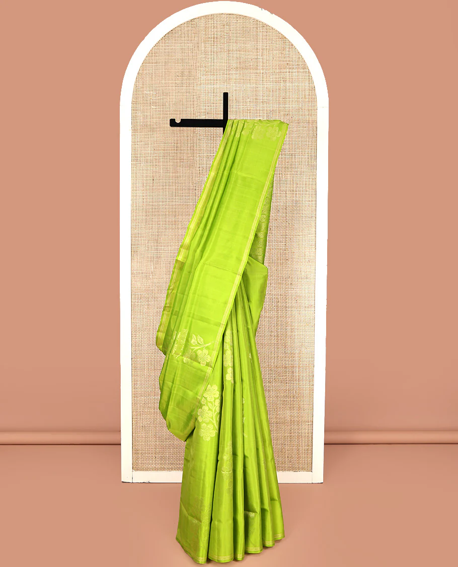 Borderless Green Mayuri Lite Silk Mix Saree, Charmingly Accented with Floral Zari Buttas All Over Its Body, Highlighted by a Pallu of Geometric Designs, and Paired with a Matching Blouse