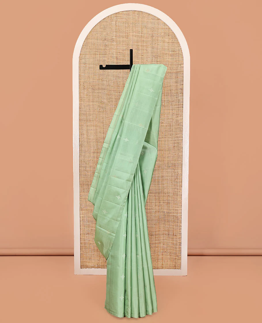 Borderless Green Mayuri Soft Silk Saree, Woven with Buttas All Over Its Body, Sparsely Sparkled Pallu, and Paired with a Matching Blouse