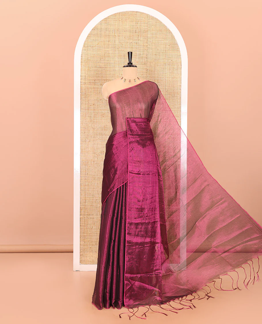 Borderless magenta plain khadi tissue saree self pallu with tassels and a matching blouse