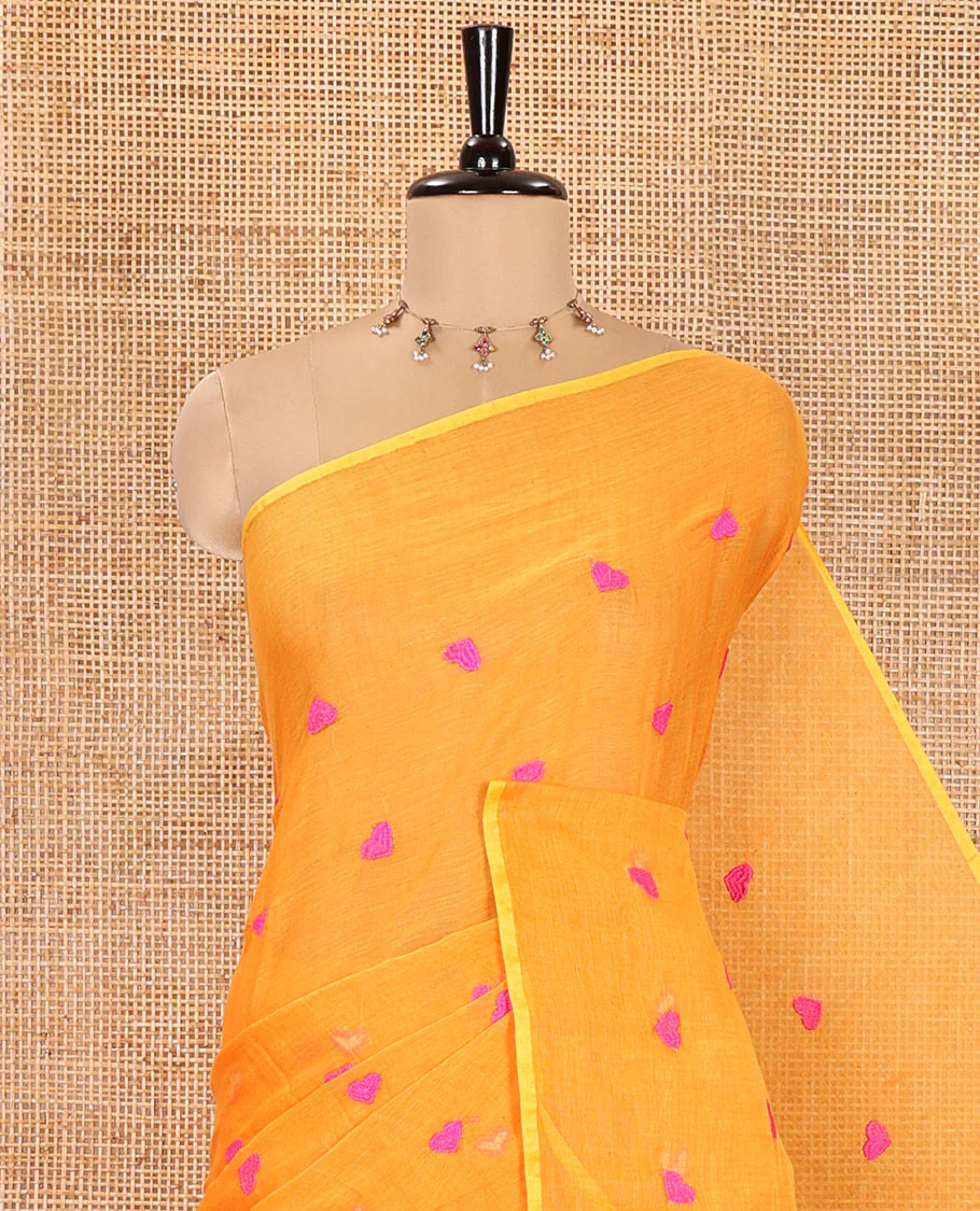 Borderless Orange Khadi Mul Cotton Saree, Artfully Designed with Heart Motifs Embroidery Across Its Body, Pallu mirrors the Same Design, and Paired with a Matching Blouse - Image 2