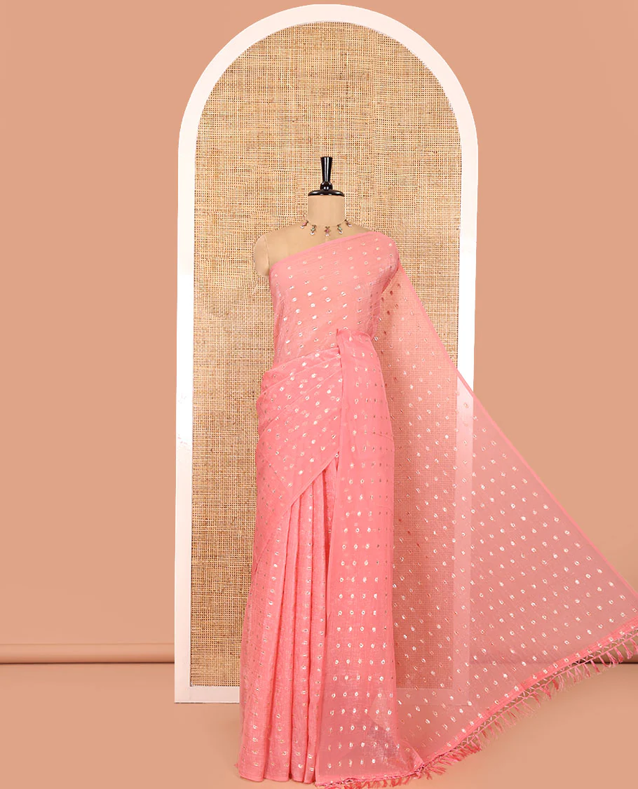 Borderless Peach Shimmer Saree, Beautified with Zari Buttas All Over Its Body, Pallu Mirrors the Same Buttas, and Comes Without a Blouse