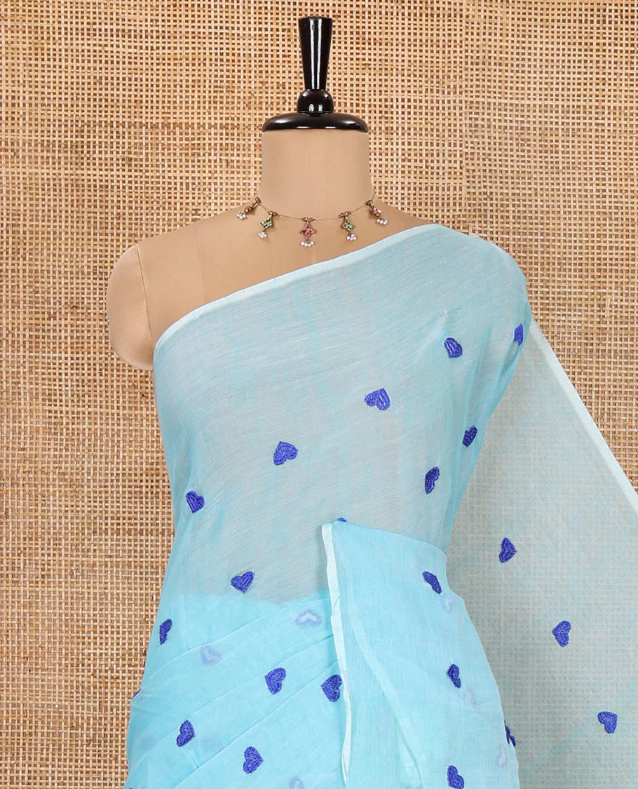 Borderless Sky Blue Khadi Mul Cotton Saree, Artfully Designed with Heart Motifs Embroidery Across Its Body, Pallu mirrors the Same Design, and Paired with a Matching Blouse - Image 2