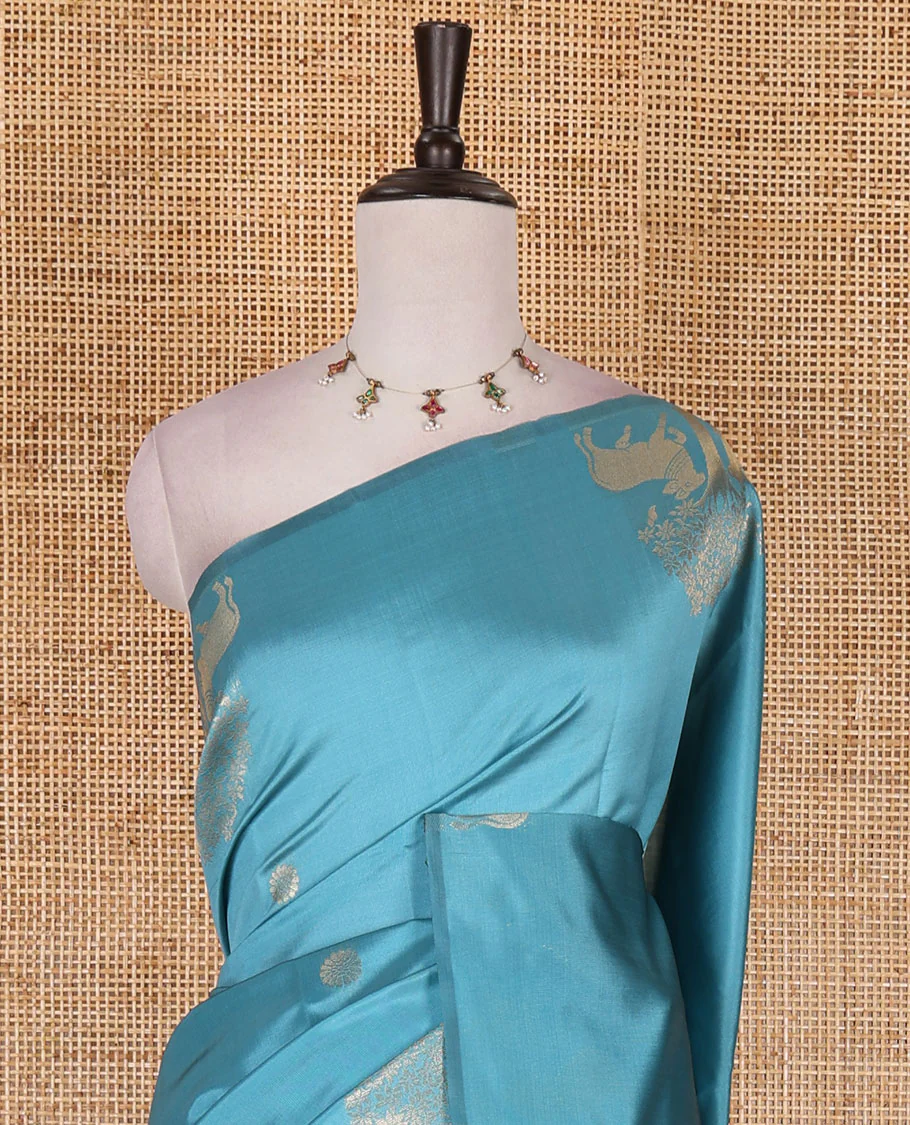 Borderless sky blue peacock, chakra, and pichwai cow buttas zari woven kanchi silk saree, peacock and chakra enclosed checked pallu, and matching blouse - Image 3