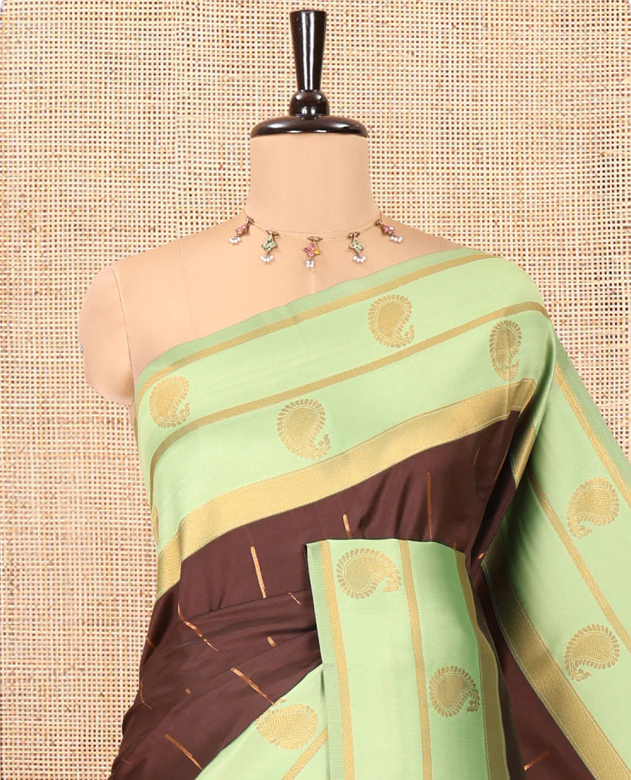 Brown and Green Kanchi Silk Saree, Ornamented with Zari Buttas All Over Its Body, Complemented by a Contrast Border of Paisleys, Zari-Striped Pallu, and Paired with a Contrast Jacquard Blouse - Image 2