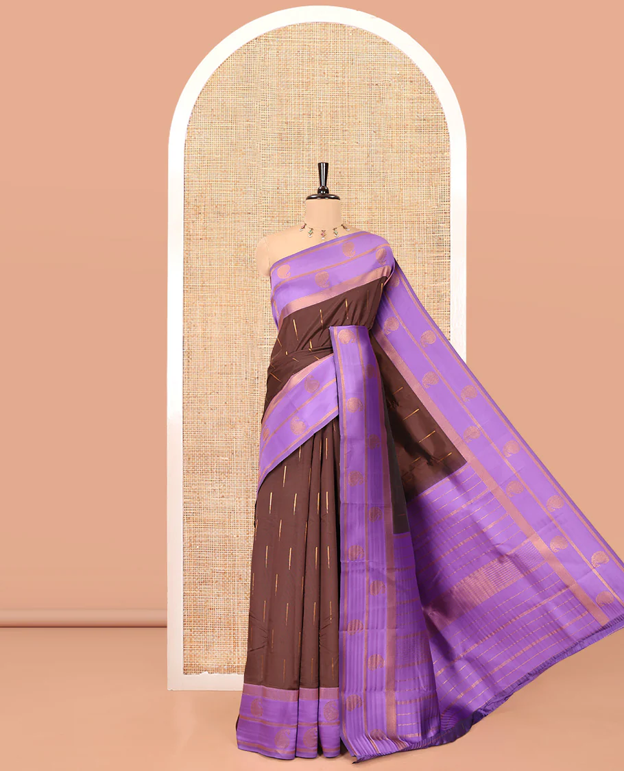 Brown and Lavender Kanchi Silk Saree, Adorned with Zari Buttas All Over Its Body, Complemented by a Contrast Border of Paisleys, Zari-Striped Pallu, and Paired with a Contrast Jacquard Blouse