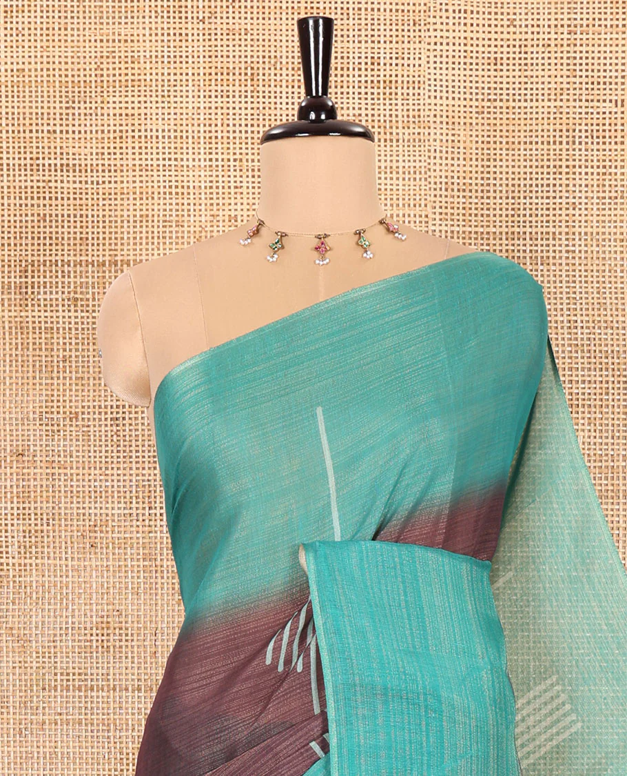Brown and Rama Green Linen Saree Elegantly Printed with Geometric Patterns Across Its Body, Featuring a Captivating Contrast Border, Pallu Decked Up with Geometric Print, and Paired with a Contrast Blouse - Image 2