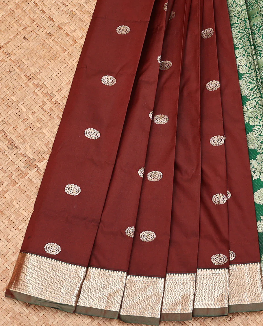 Brown Budget Silk Saree, Opulently Embellished with Zari Buttas, Complemented by a Contrast Traditional Zari Design Border, Grand Floral Design Pallu, and Paired with a Contrast Blouse