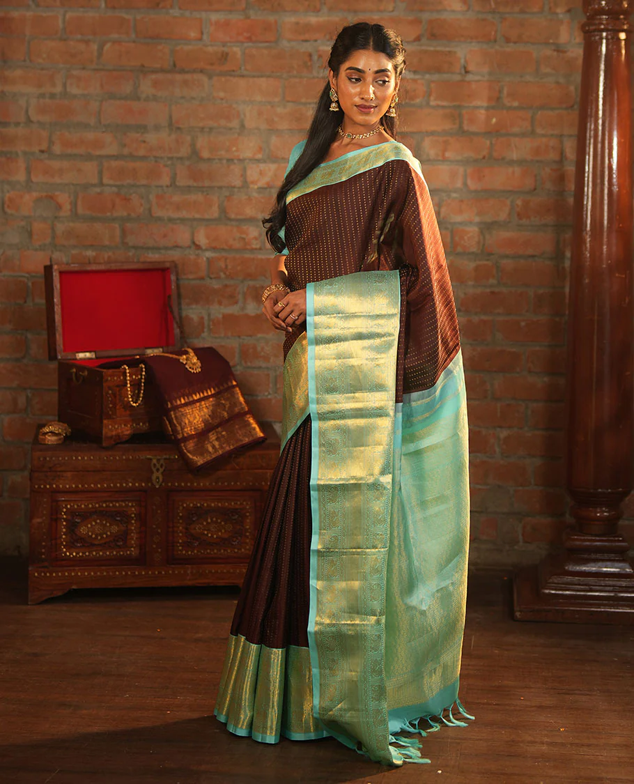 Brown Vasundhara Silk Saree Delicately Woven with Zari Buttas, Highlighted with a Contrast Border of Cross Kamalam, Mayil, Banaras, Yaanai, and Mayil Kann Designs, Pallu Grandly Woven with Jaal Designs, and Paired with a Contrast Blouse - Image 5