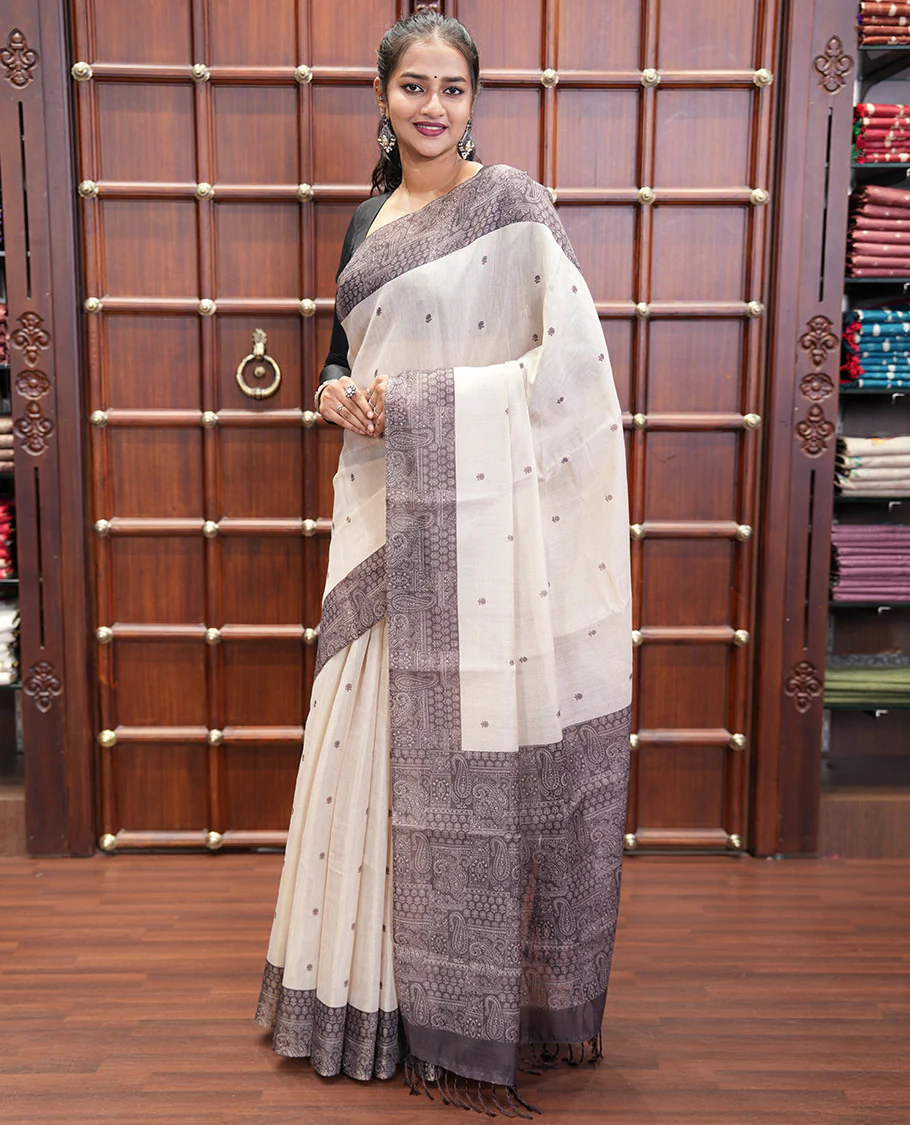 Chikku and Black Tissue Linen Saree, Delicately Printed with Floral Motifs on Its Body, Complemented by a Contrast Border of Paisley Designs, Pallu Steeped with Paisley Designs, and Paired with a Contrast Blouse - Image 3