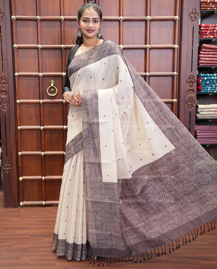 Chikku and Black Tissue Linen Saree, Delicately Printed with Floral Motifs on Its Body, Complemented by a Contrast Border of Paisley Designs, Pallu Steeped with Paisley Designs, and Paired with a Contrast Blouse - Image 4