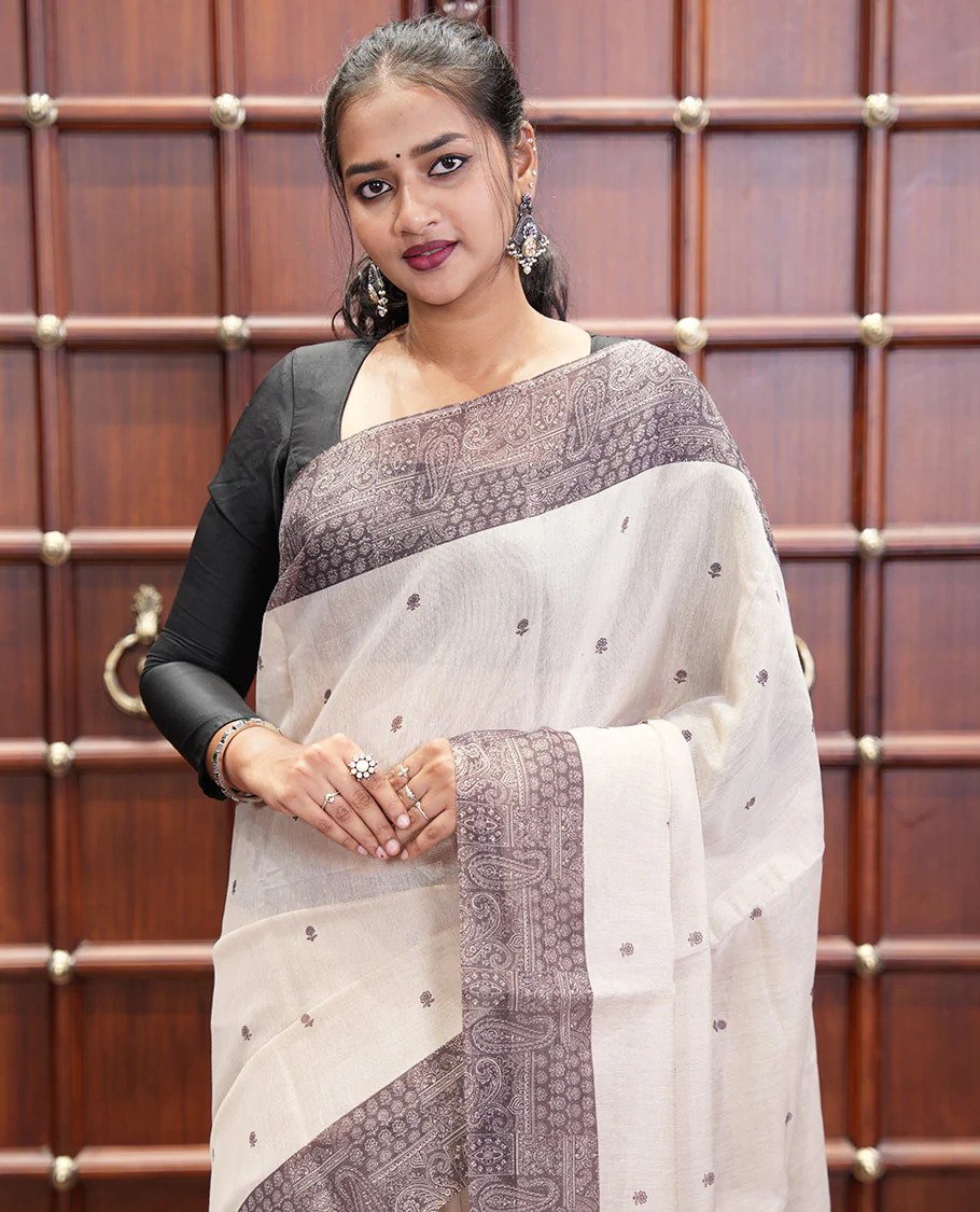 Chikku and Black Tissue Linen Saree, Delicately Printed with Floral Motifs on Its Body, Complemented by a Contrast Border of Paisley Designs, Pallu Steeped with Paisley Designs, and Paired with a Contrast Blouse - Image 5