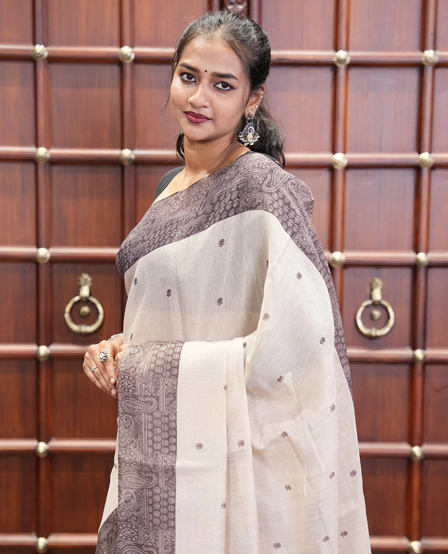 Chikku and Black Tissue Linen Saree, Delicately Printed with Floral Motifs on Its Body, Complemented by a Contrast Border of Paisley Designs, Pallu Steeped with Paisley Designs, and Paired with a Contrast Blouse - Image 6