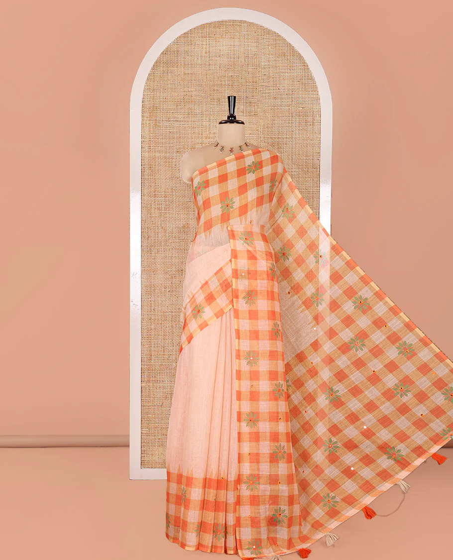 Chikku and Orange Linen Cotton Saree, Elevated with Mirror Work On Its Body, Complemented by Contrast Temple Checked Border of Floral Print and Mirror Work, Pallu Mirrors the Same Design and Paired with a Contrast Blouse