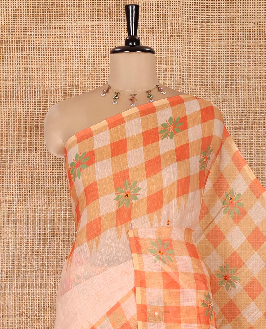 Chikku and Orange Linen Cotton Saree, Elevated with Mirror Work On Its Body, Complemented by Contrast Temple Checked Border of Floral Print and Mirror Work, Pallu Mirrors the Same Design and Paired with a Contrast Blouse - Image 2
