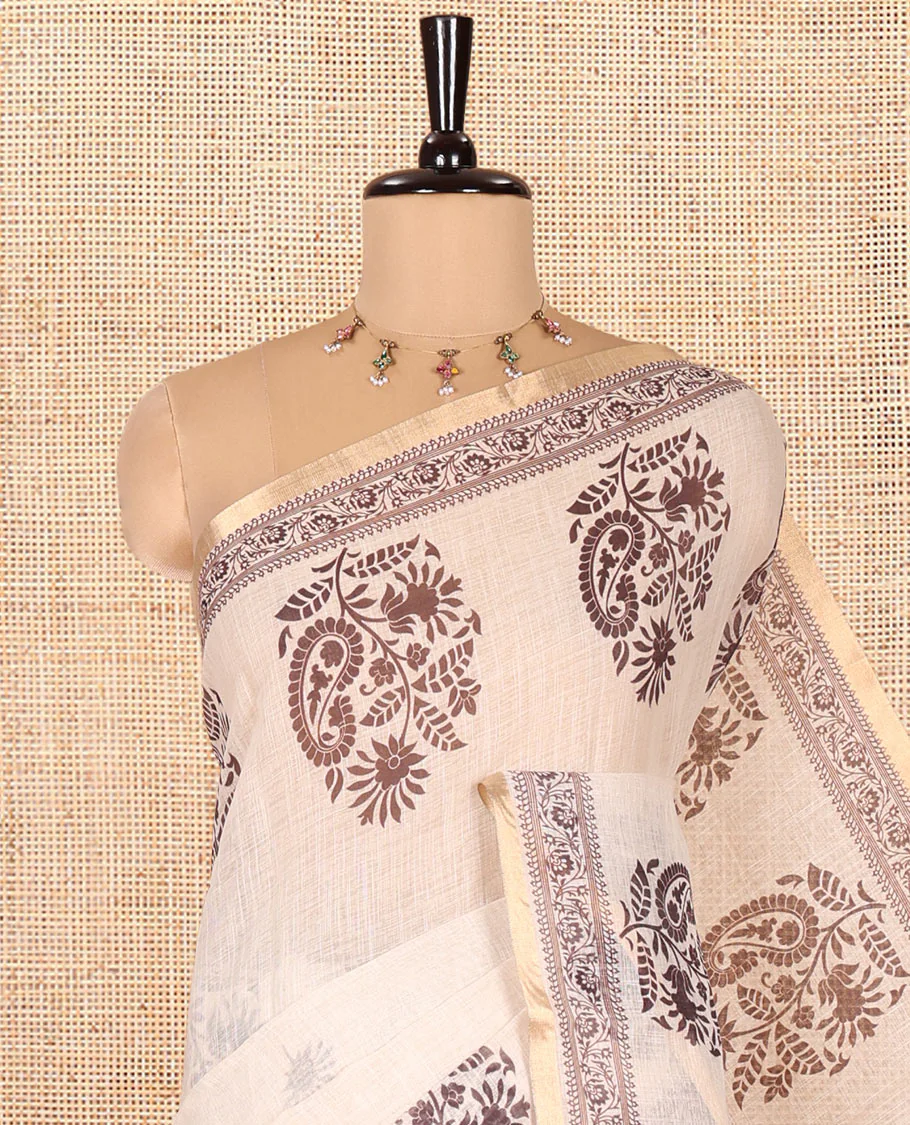 Chikku Linen Cotton Saree, Delicately Designed with Floral-Paisley Motifs Print All Over Its Body, Highlighted by Gold Zari Printed Border, Floral-Paisley Printed Pallu and Paired with a Matching Blouse - Image 2