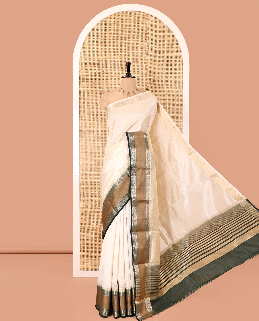 Cream and Green Plain Art Tussar Saree, Complemented by a Contrast Rettai Pettu Traditional Zari Border, Zari Striped Pallu, and Paired with a Contrast Blouse