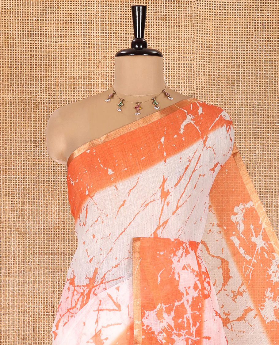 Cream and Orange Linen Cotton Saree, Adorned with Batik Print on Its Body, Complemented by Contrast Batik Printed Border, Pallu of Floral Print, and Paired with a Contrast Blouse - Image 2