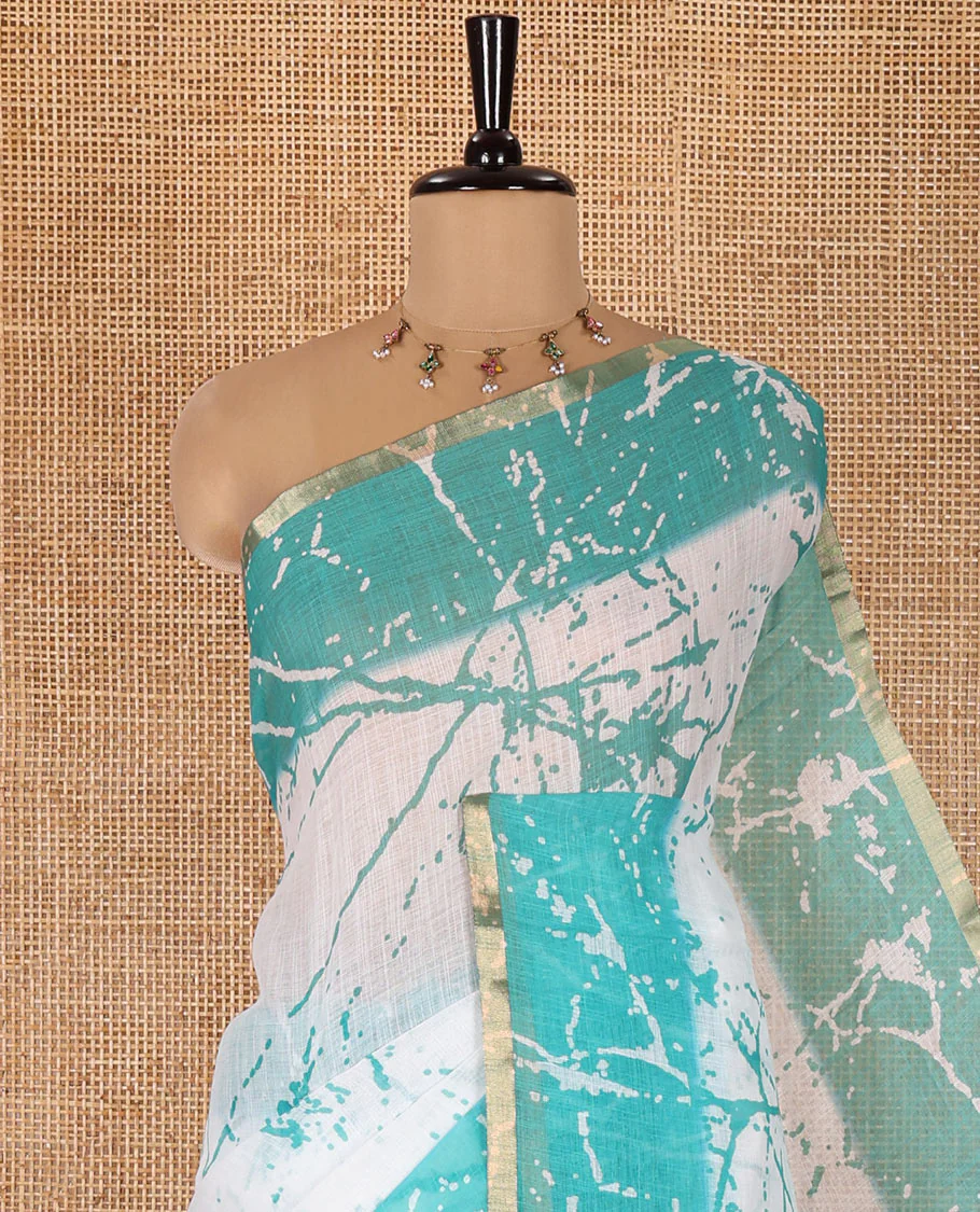 Cream and Rama Linen Cotton Saree, Decorated with Batik Print on Its Body, Complemented by Contrast Batik Printed Border, Pallu of Floral Print, and Paired with a Contrast Blouse - Image 2