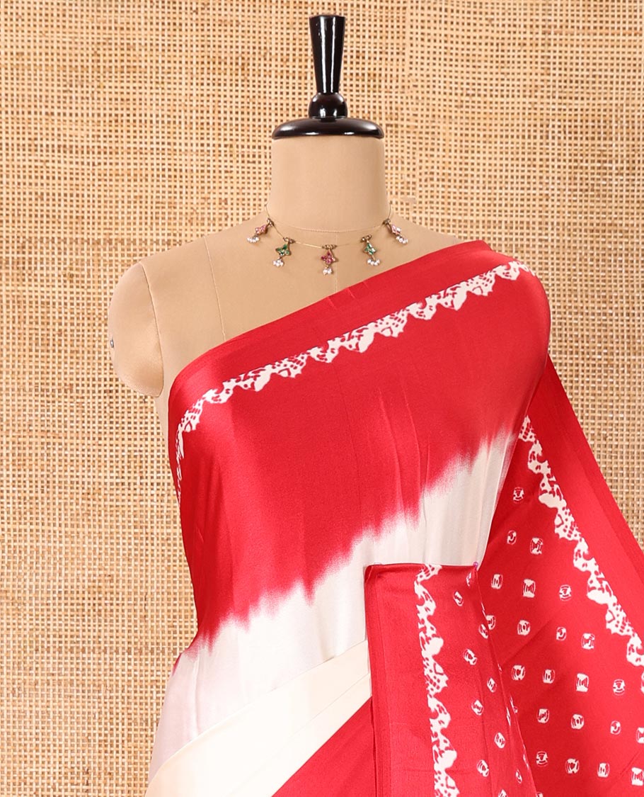 Cream and Red Satin Crepe Saree Adorned with Shibori Prints, Complemented by Contrast Shibori Printed Border, Pallu Decked Up with Shibori Prints, and Paired with a Plain Blouse - Image 2