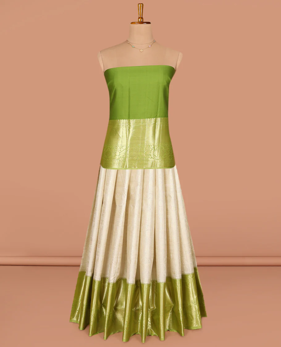 Cream Art Silk Pavadai Material Set, Subtly Sparkled with Jacquard Designs on Its Skirt, Complemented by a Contrast Traditional Zari Design Big Border, and Paired with a Contrast Blouse