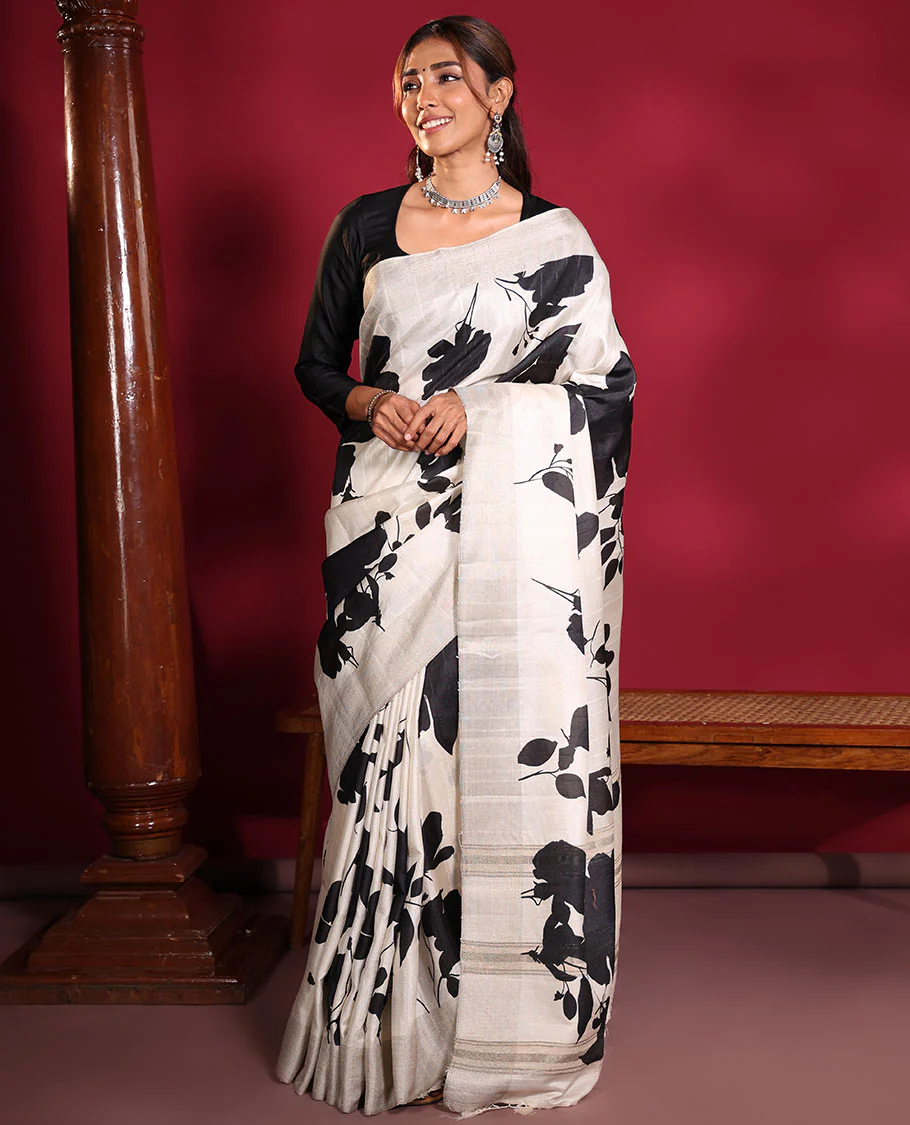 Cream Fancy Tussar Saree, Artfully Detailed with Silhouette-Style Floral Motifs Printed on Its Body, Subtle Zari-Textured Border, Pallu Pictures the Same Floral Print, and Paired with a Matching Blouse - Image 4