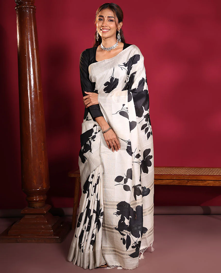 Cream Fancy Tussar Saree, Artfully Detailed with Silhouette-Style Floral Motifs Printed on Its Body, Subtle Zari-Textured Border, Pallu Pictures the Same Floral Print, and Paired with a Matching Blouse - Image 6
