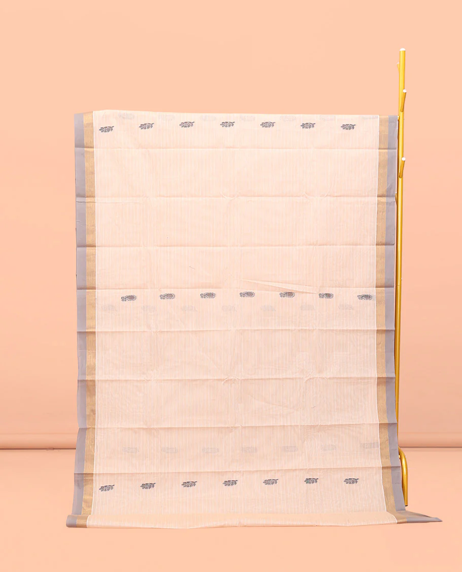 Cream Kanchi Cotton Saree, Bedecked with Buttas and Stripes All Over Its Body, Complemented by Contrast Border, Ogee Patterned Pallu, and Paired with a Matching Blouse