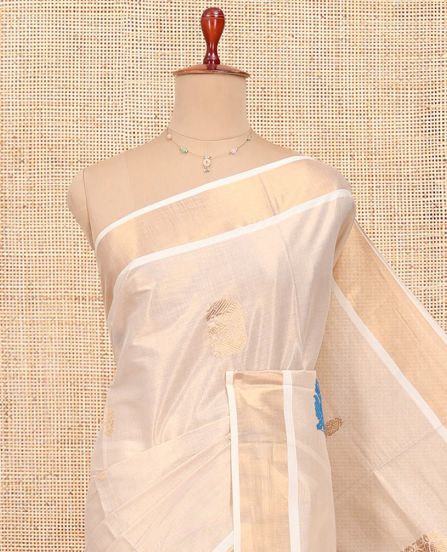 Cream Kerala Cotton Saree, Bedecked with Thread and Zari Buttas All Over Its Body, a Zari Bavanji Border, Pallu of Intricate Designs, and Paired with a Matching Blouse - Image 2