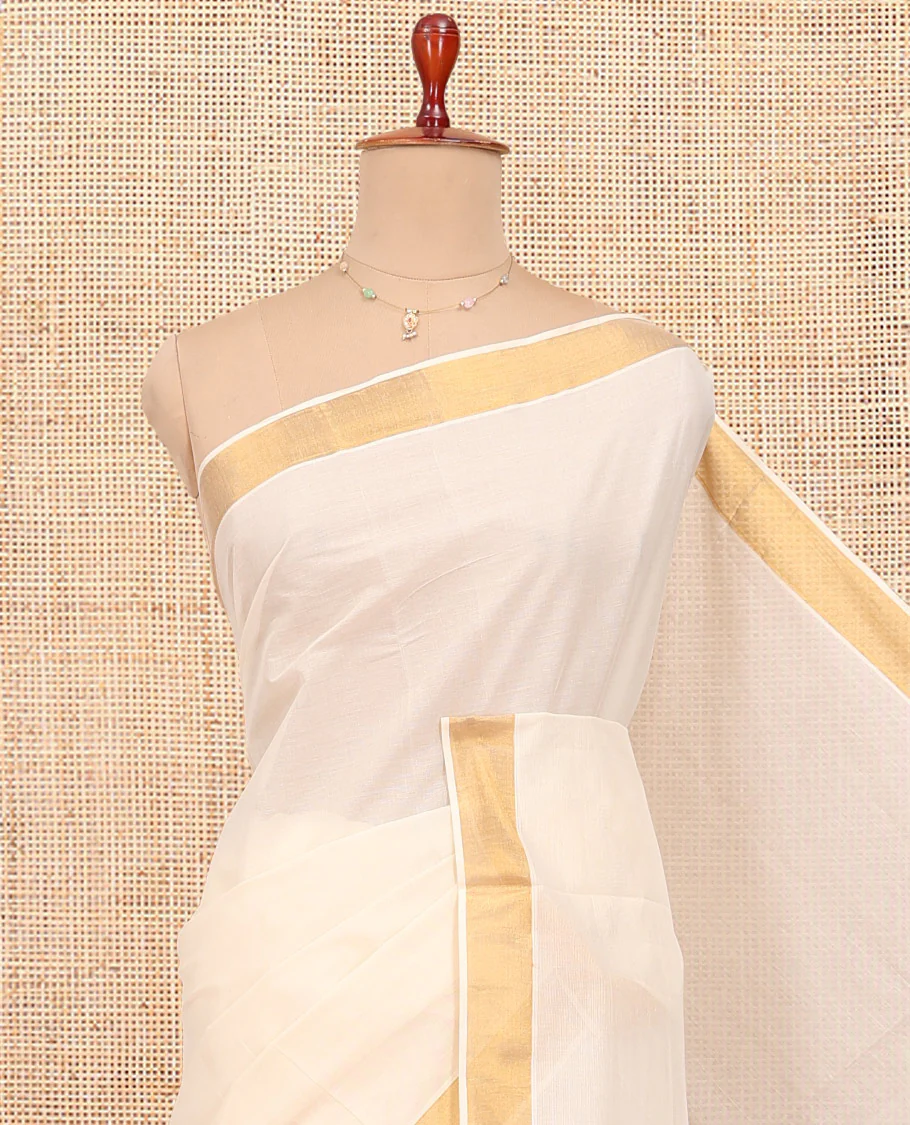 Cream Kerala Cotton Saree, Decked up with Zari Buttas All Over Its Body, a Zari Bavanji Border, Pallu of Intricate Designs, and Paired with a Matching Blouse - Image 2