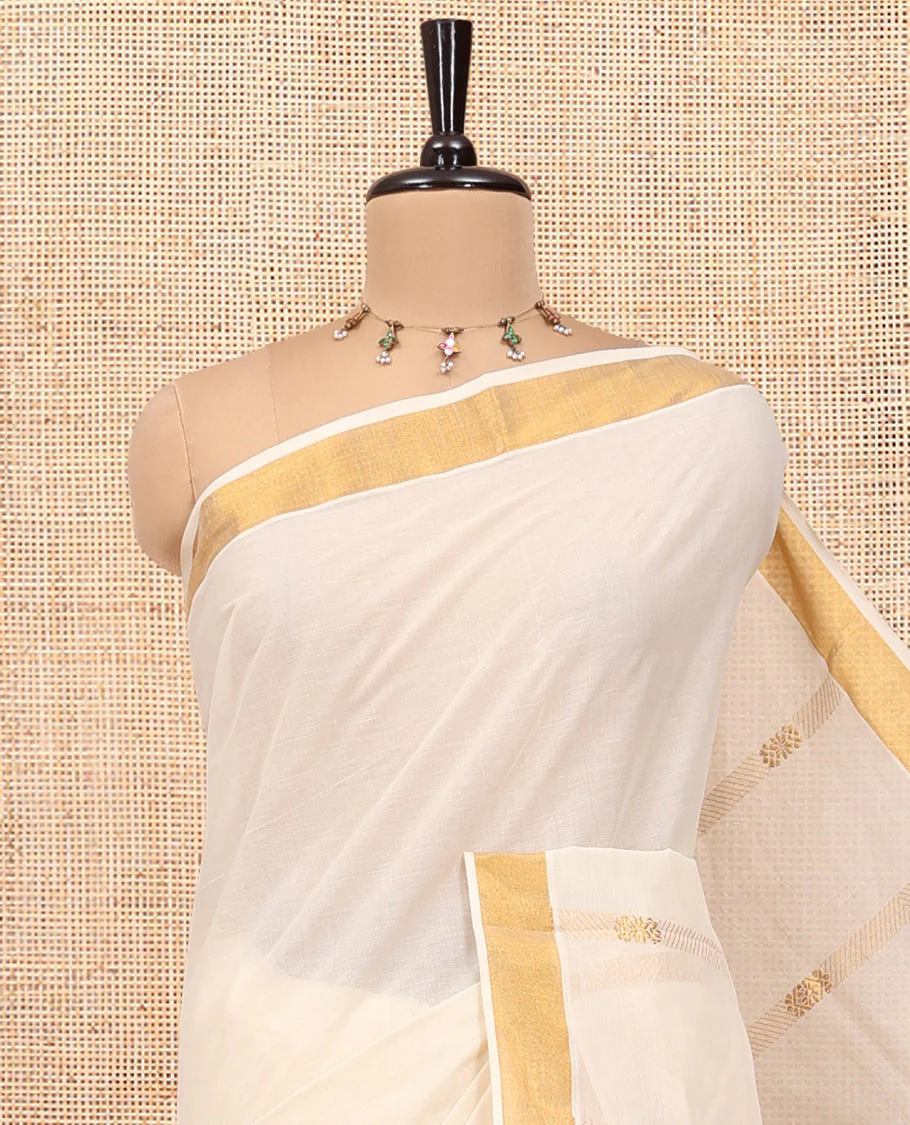 Cream Kerala Cotton Saree, Delicately Woven with Zari Stripes All Over Its Body, a Subtle Bavanji Border, Pallu Depicts Peacock Designs, and Paired with a Matching Blouse - Image 2