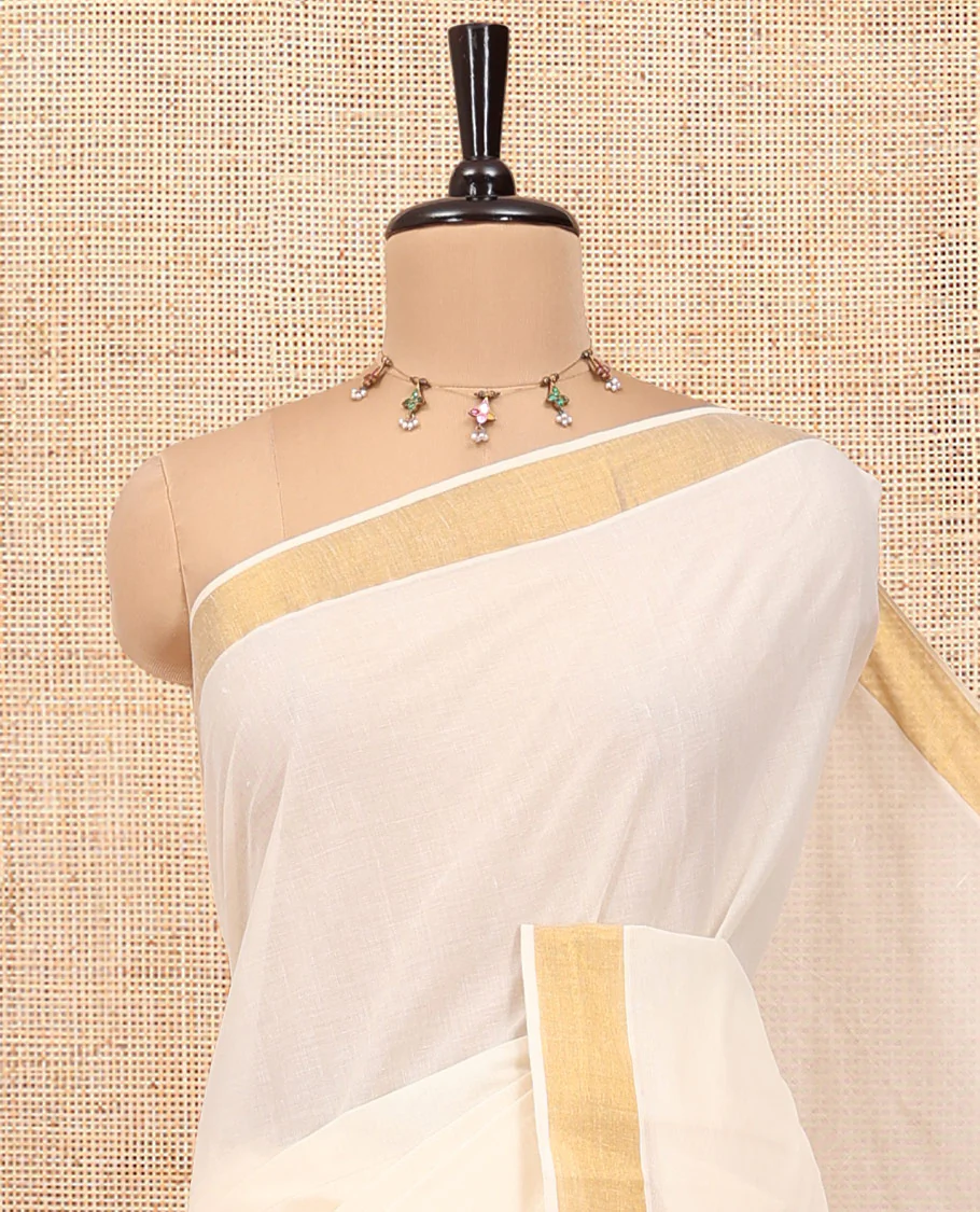 Cream Kerala Cotton Saree, Embellished with Zari Stripes All Over Its Body, a Subtle Bavanji Border, Pallu of Floral-Paisley Designs, and Paired with a Matching Blouse - Image 2