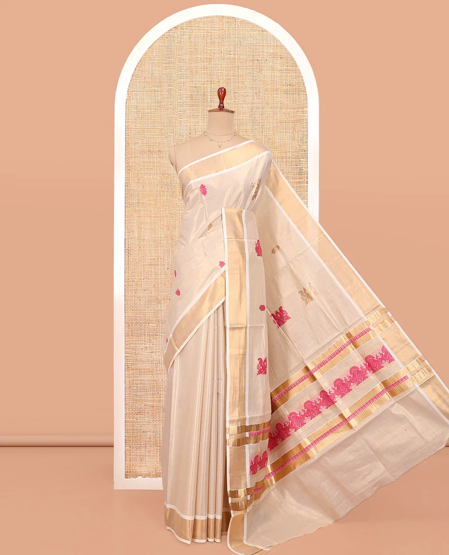 Cream Kerala Cotton Saree, Spotlighted with Thread and Zari Buttas All Over Its Body, a Zari Bavanji Border, Pallu of Elephant Designs, and Paired with a Matching Blouse