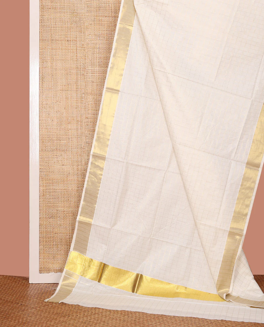 Cream Kerala Cotton Saree Subtly Woven with Checks All Over Its Body, Zari Bavanji Border, Zari Woven Pallu, and Paired with a Matching Blouse
