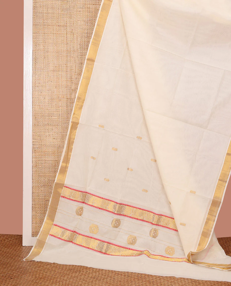 Cream Kerala Saree, Enriched with Zari Buttas on Its Body, Bavanji Zari Border, Sparkling Zari Woven Pallu of Flower Designs, and Paired with a Matching Blouse
