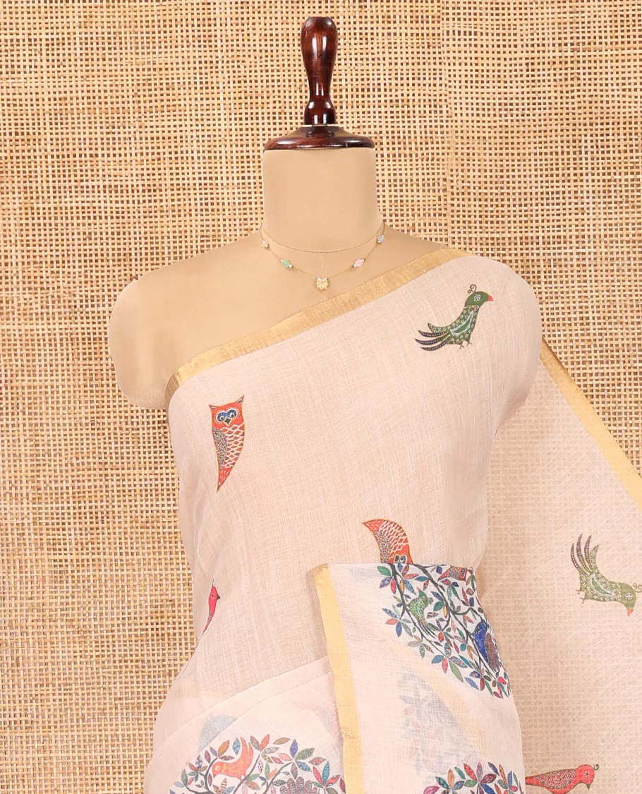 Cream Linen Cotton Saree, Steeped in the Richness of Nature-Themed Motifs Like Bird, Owl, and Tree, a Subtle Piping Border, Pallu of Tree Motifs, and Paired with a Matching Blouse - Image 2