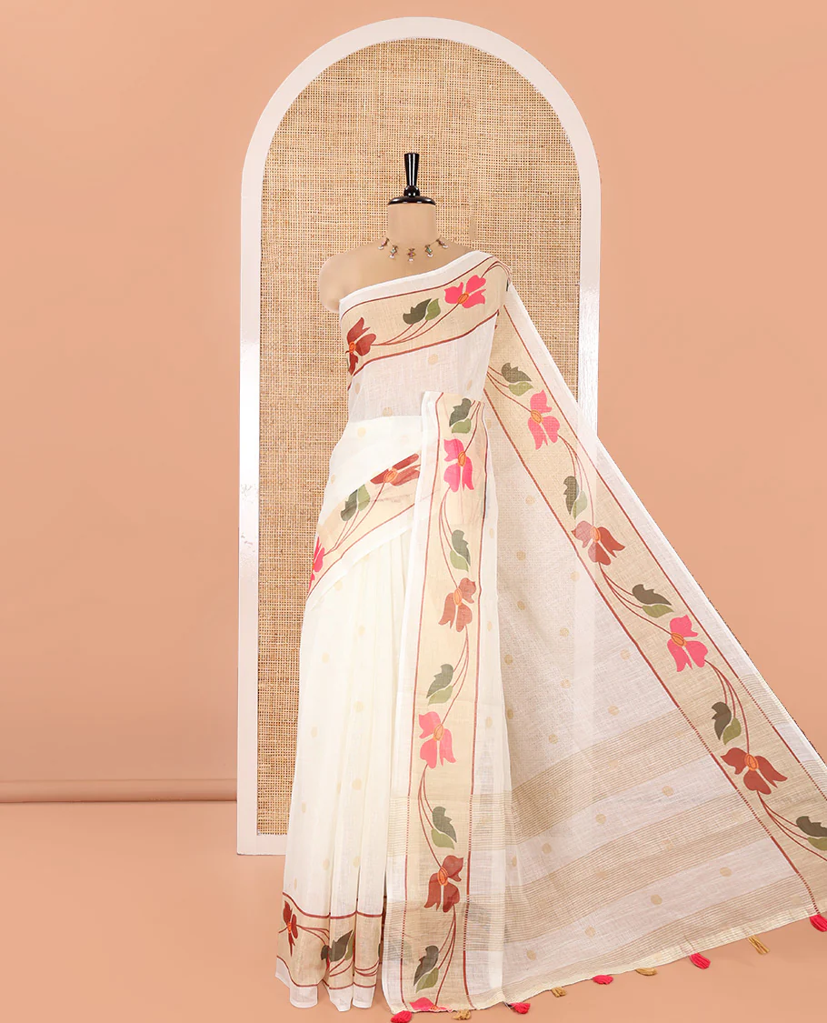 Cream Linen Cotton Saree, Subtly Sparkled with Zari Buttas All Over Its Body, Highlighted by Contrast Floral Creeper Design Border, Subtle Pallu and Paired with a Striped Blouse