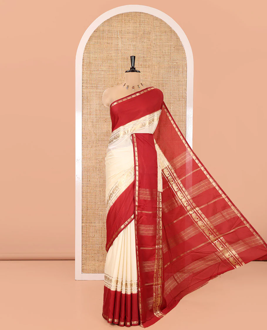 Cream Plain Art Mysore Silk Saree, Complemented by Captivating Contrast Rettai Pettu Traditional Border of Elephant Zari Buttas, Striped Pallu, and Paired with a Contrast Blouse