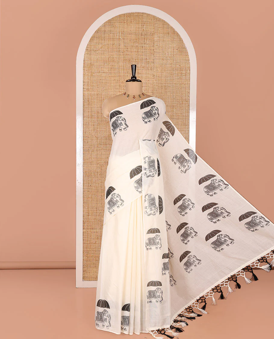 Cream Plain Kerala Cotton Saree, Creatively Printed with Elephant With Umbrella Motifs On Its Border, Pallu Steeped with Same Motifs Print, and Paired with a Matching Blouse
