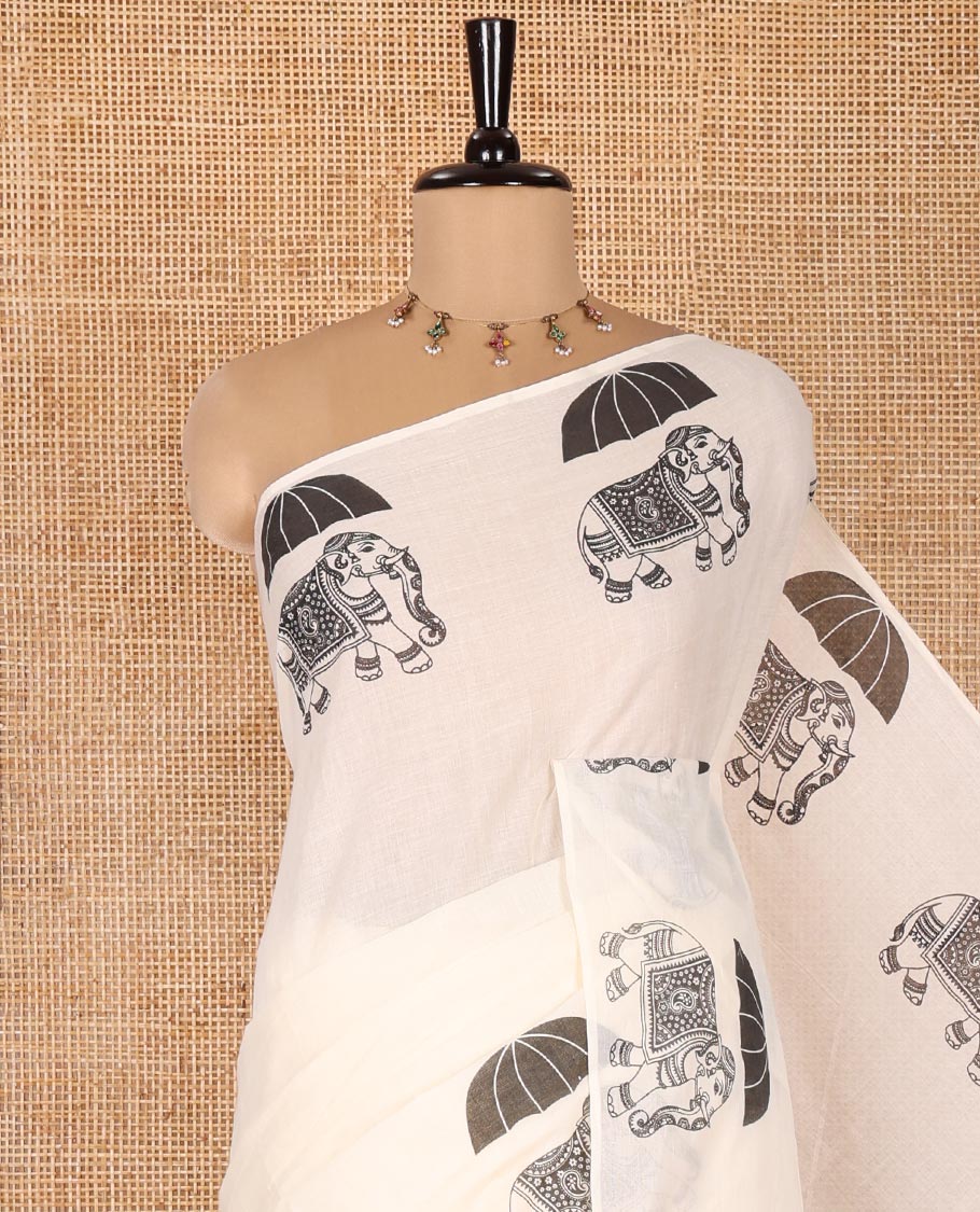 Cream Plain Kerala Cotton Saree, Creatively Printed with Elephant With Umbrella Motifs On Its Border, Pallu Steeped with Same Motifs Print, and Paired with a Matching Blouse - Image 2