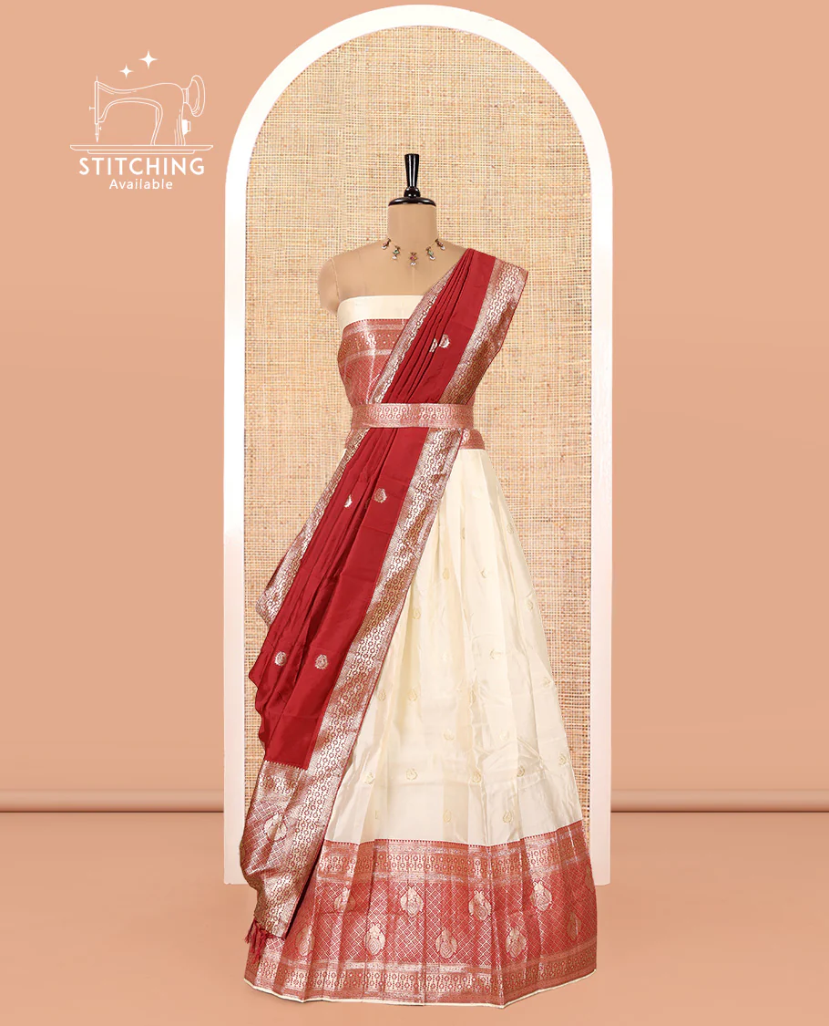 Cream-Red Semi-Banarasi Half-Saree Set Featuring Buttas Skirt, Contrast Traditional Border, Matching Blouse, and Banaras Dhavani