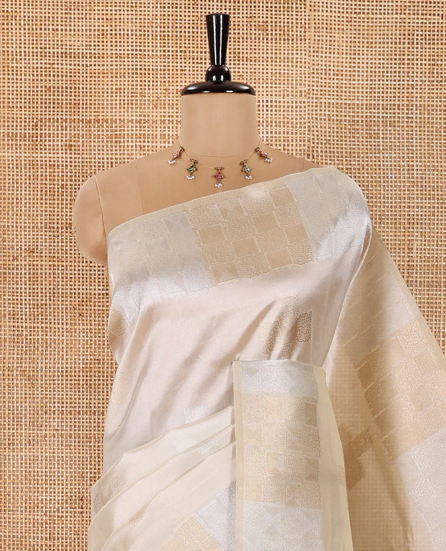 Cream Semi Tussar Saree Elevated with Zari Plus-Shaped Buttas, Gleaming Border of Intricate Zari Checks, Pallu Richly Woven with Jaal Designs, and Paired with a Matching Blouse - Image 2