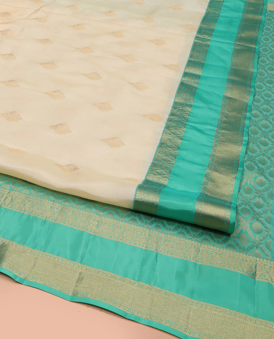 Cream Vasundhara Lite Silk Mix Saree, Gracefully Embellished with Zari Buttas All Over Its Body, Complemented by a Contrast Rettai Pettu Border of Thilakam Mokku, Kodi Visiry, and Kamalam Designs, Grand Jaal Design Pallu, and Paired with a Contrast Blouse - Image 2
