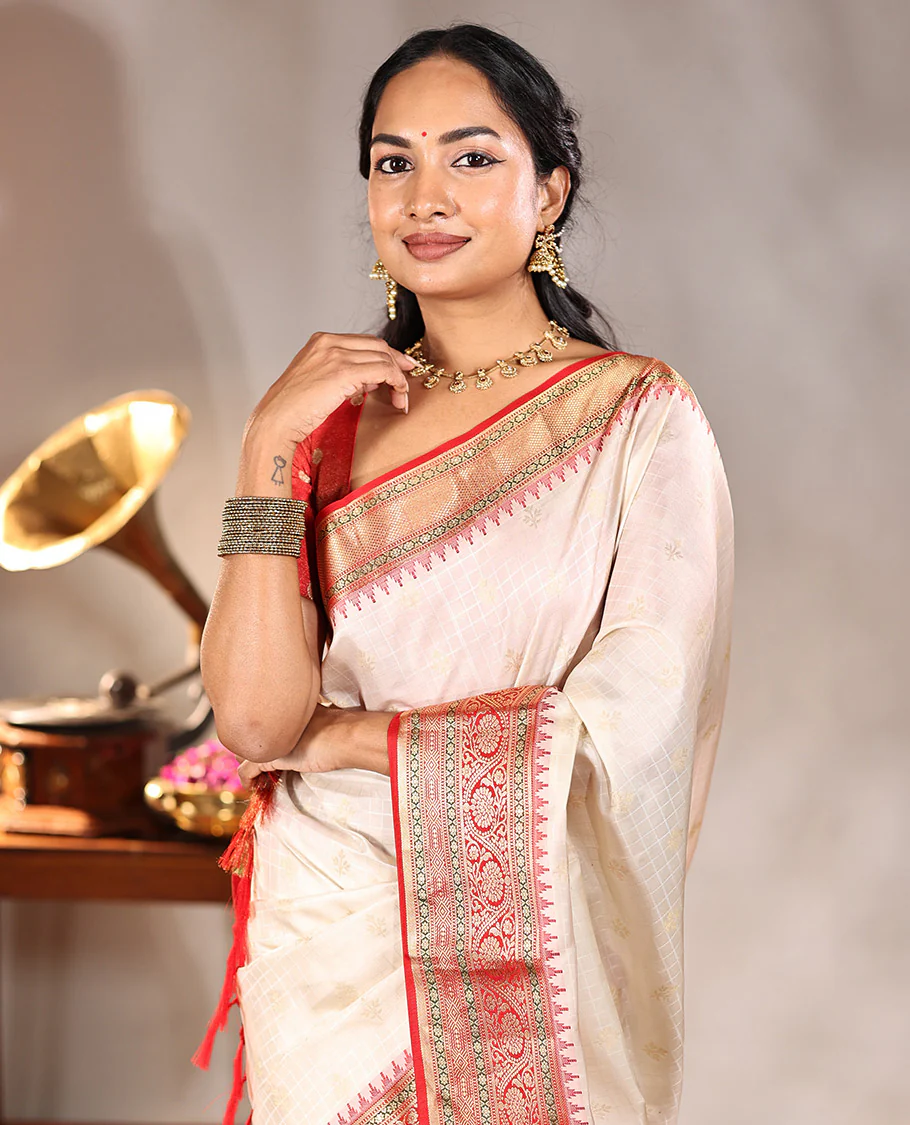 Cream Vasundhara Silk Saree, Subtly Sparkled with Buttas And Checks On Its Body, Complemented by Captivating Contrast Border of Thazampoo Rekku, Muthu, Banaras, and Kodi Visiry Designs, Pallu Steeped with Manga Designs, And Paired with a Contrast Blouse - Image 2